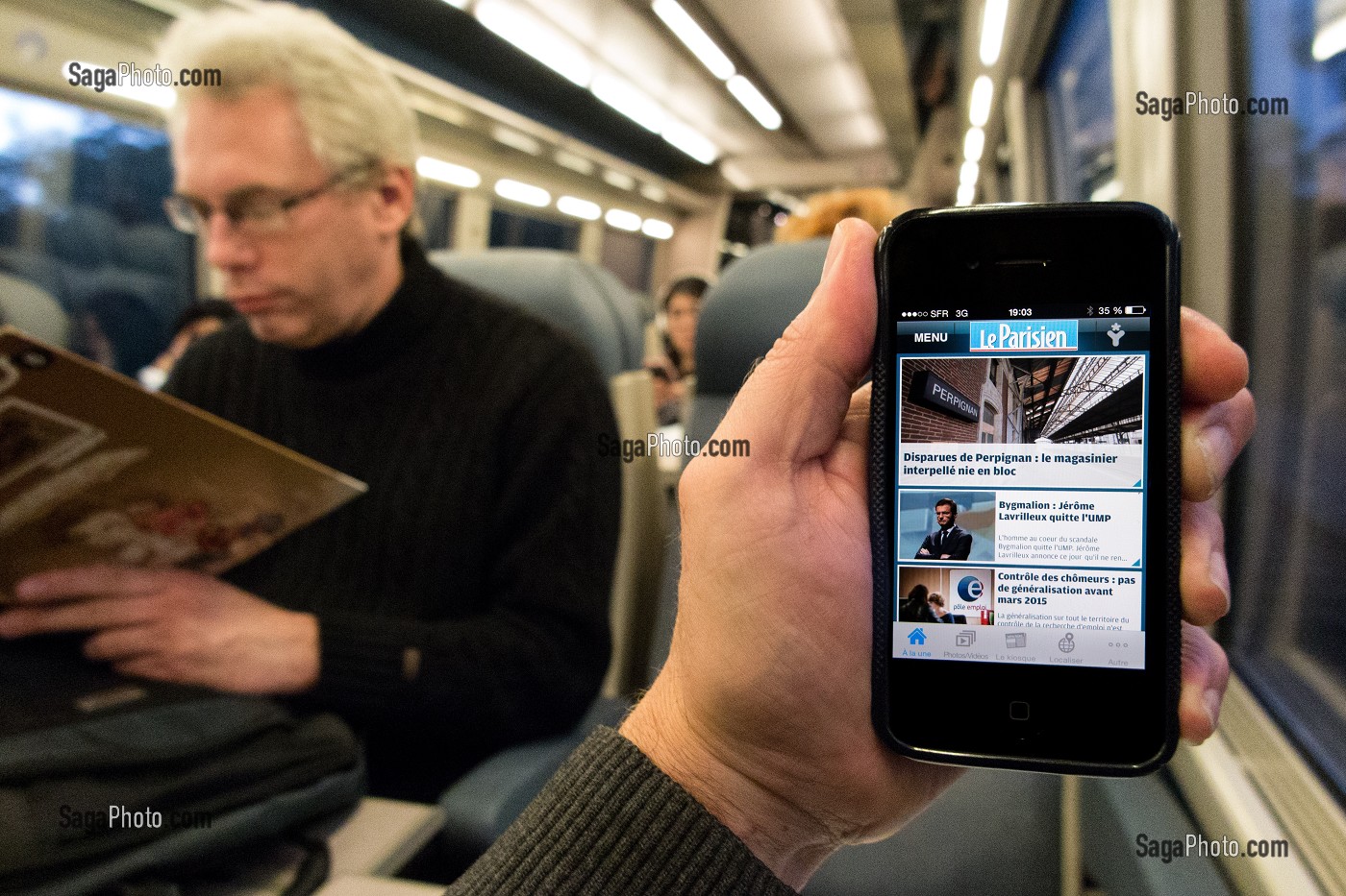 LE PARISIEN.FR JOURNAL QUOTIDIEN D'ACTUALITES, APPLICATION DE PRESSE EN LIGNE SUR TELEPHONE PORTABLE (IPHONE) DANS UN TRAIN 